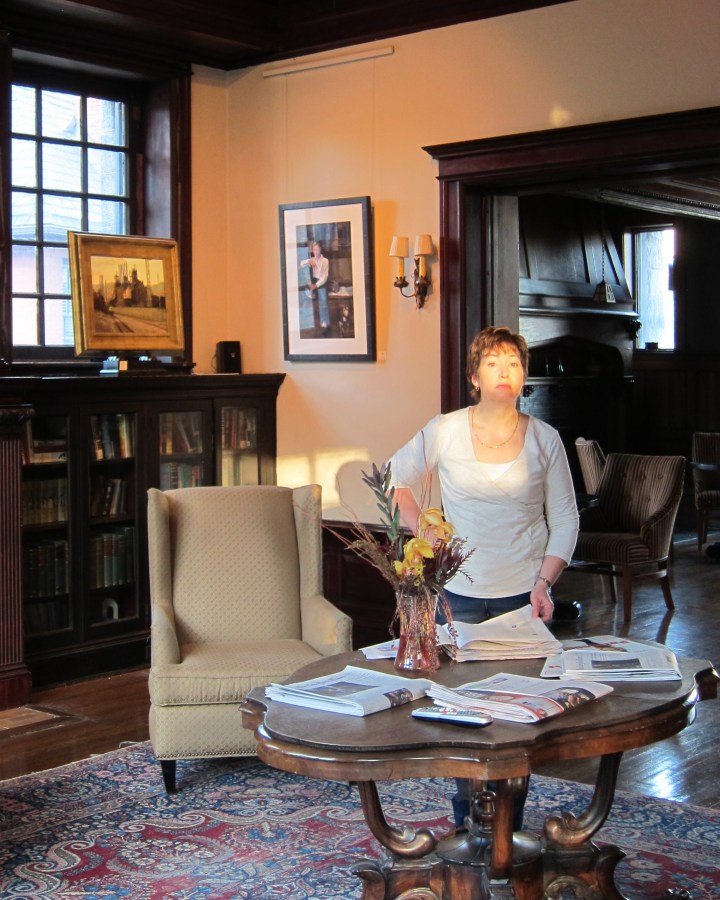Heidi peruses the paper after breakfast at the McCook mansion