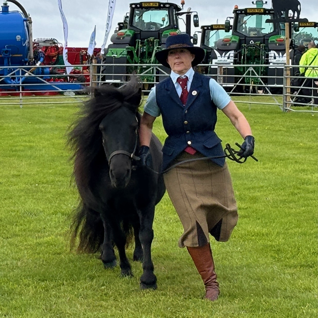 Woman running with her Shetland Pony at Kirkwall County Show.